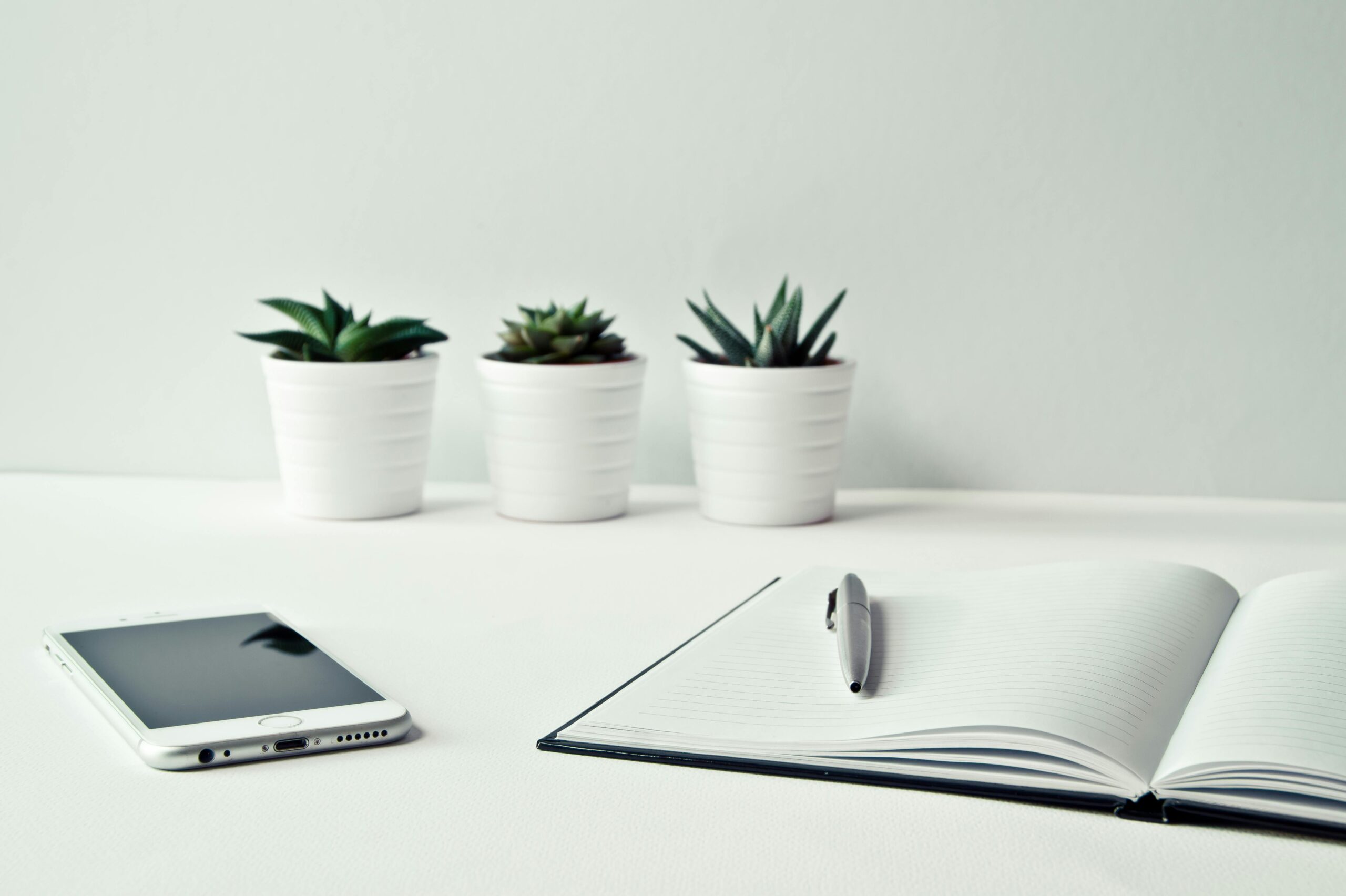 Virtual Assistant for Startups - Desk with pen and phone